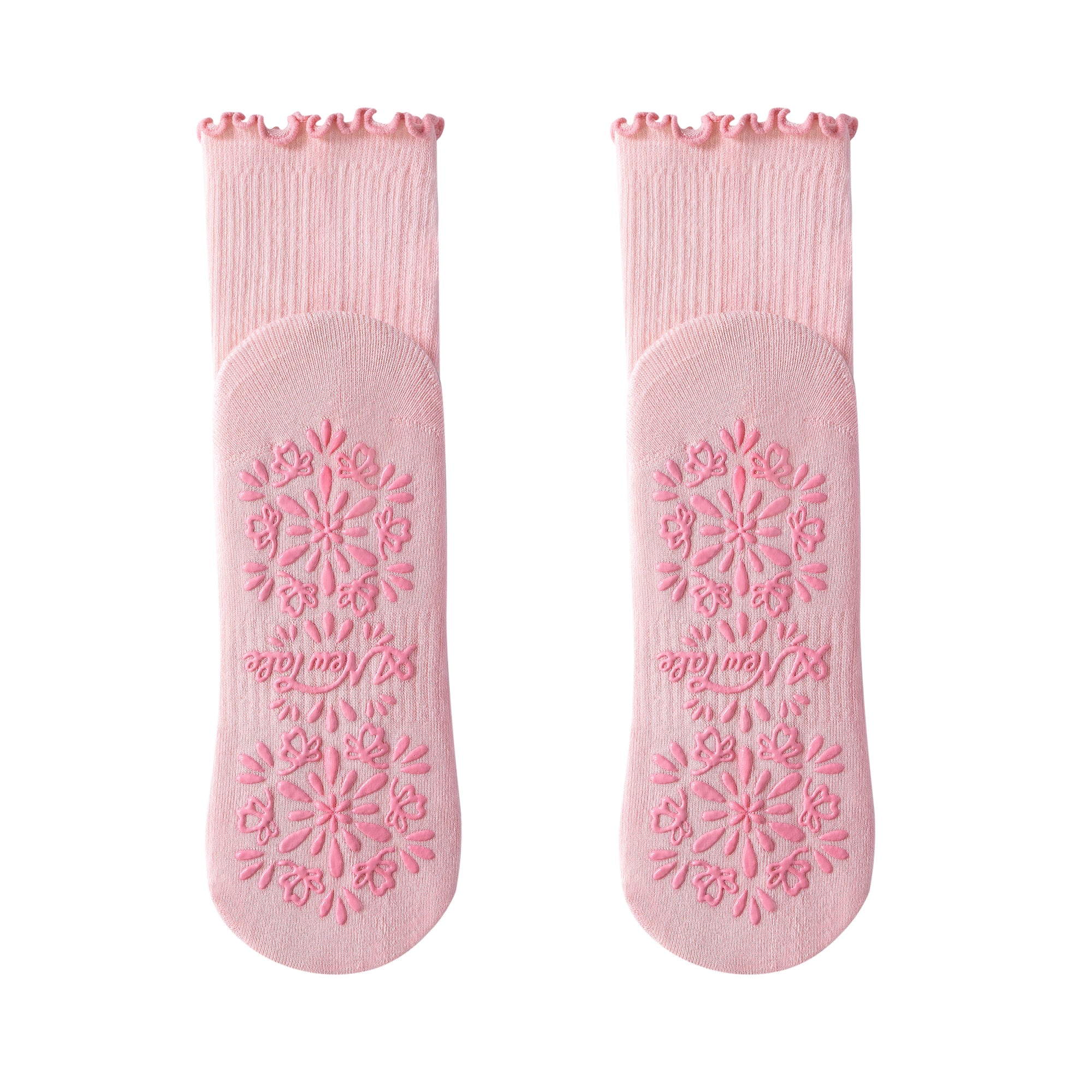 Pair of pink socks with textured sole on a white background