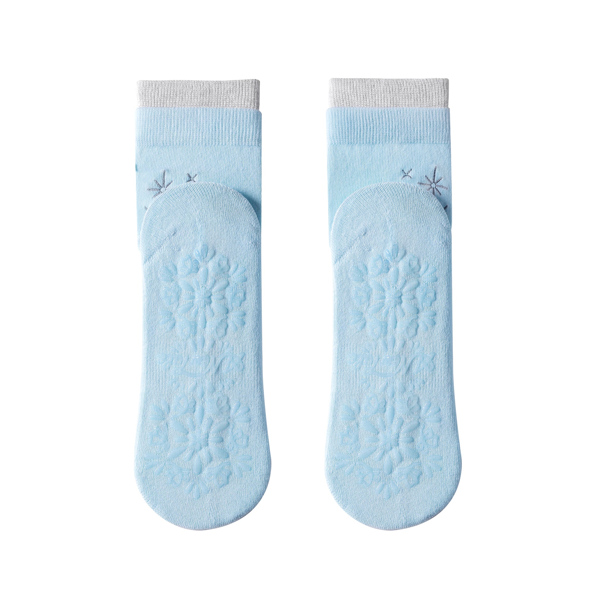 Pair of light blue socks with textured sole on a white background